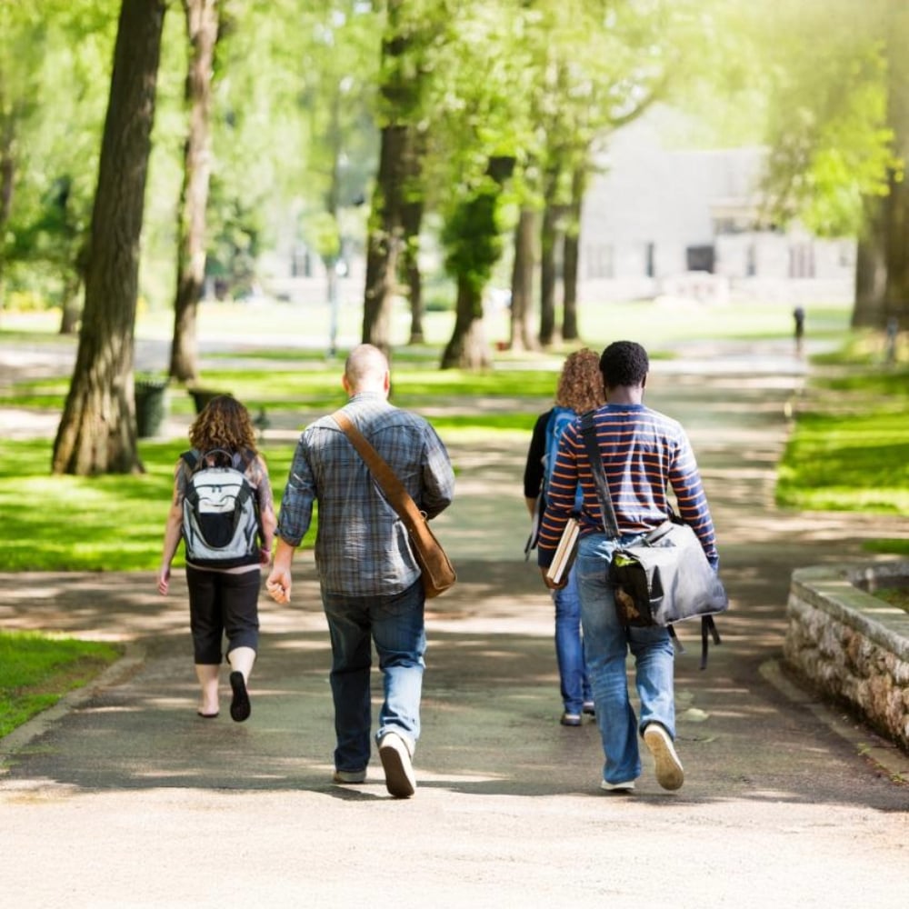 Students walking across college quad